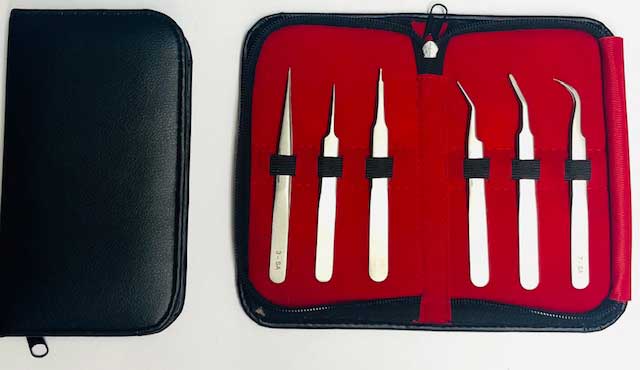 Set of SMD tweezers in a red case with black accents on a white background