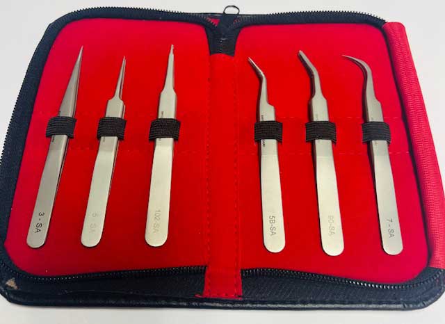 Set of 6 SMD tweezers in a red case on a white background with model numbers showing